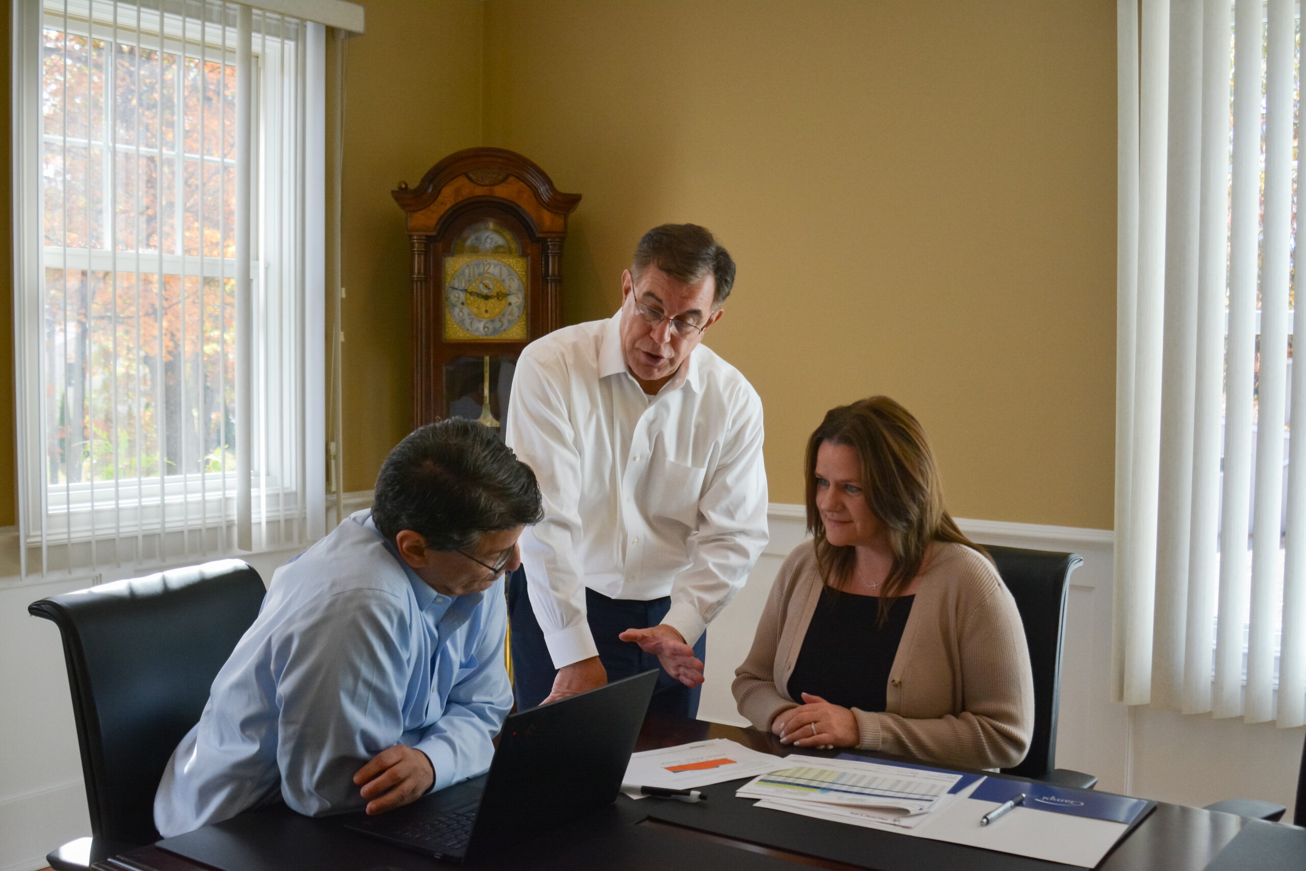 ciampi wealth management female team members photo inside at table