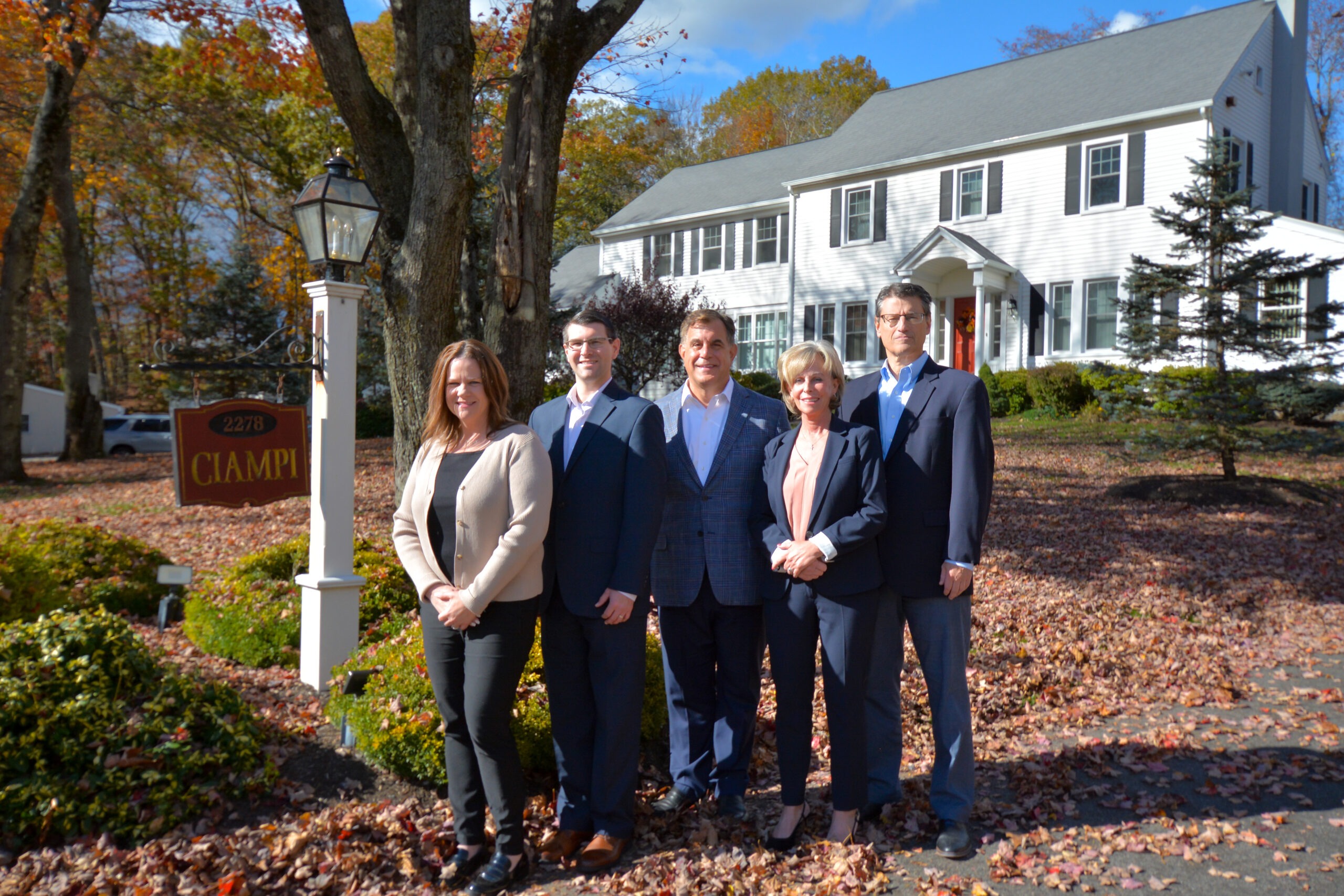 ciampi wealth management team photo outside with sign