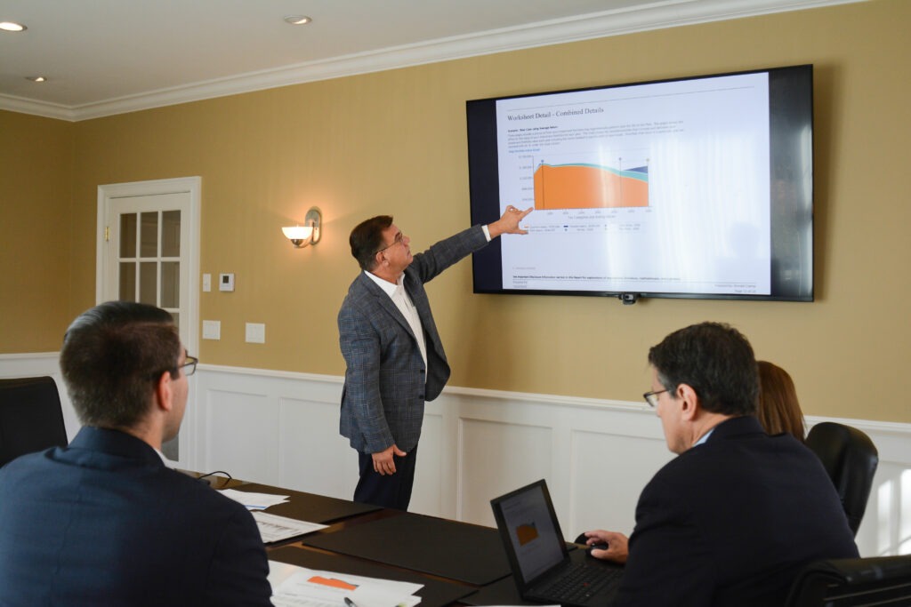 ciampi wealth management team presenting on a board